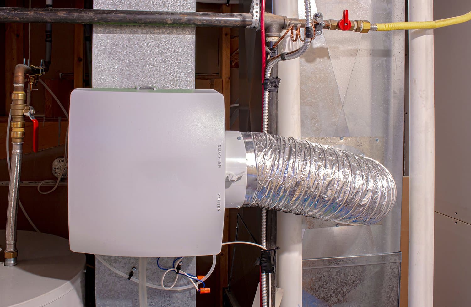 Whole-house humidifier unit installed on a home's HVAC system to add moisture to dry Colorado air