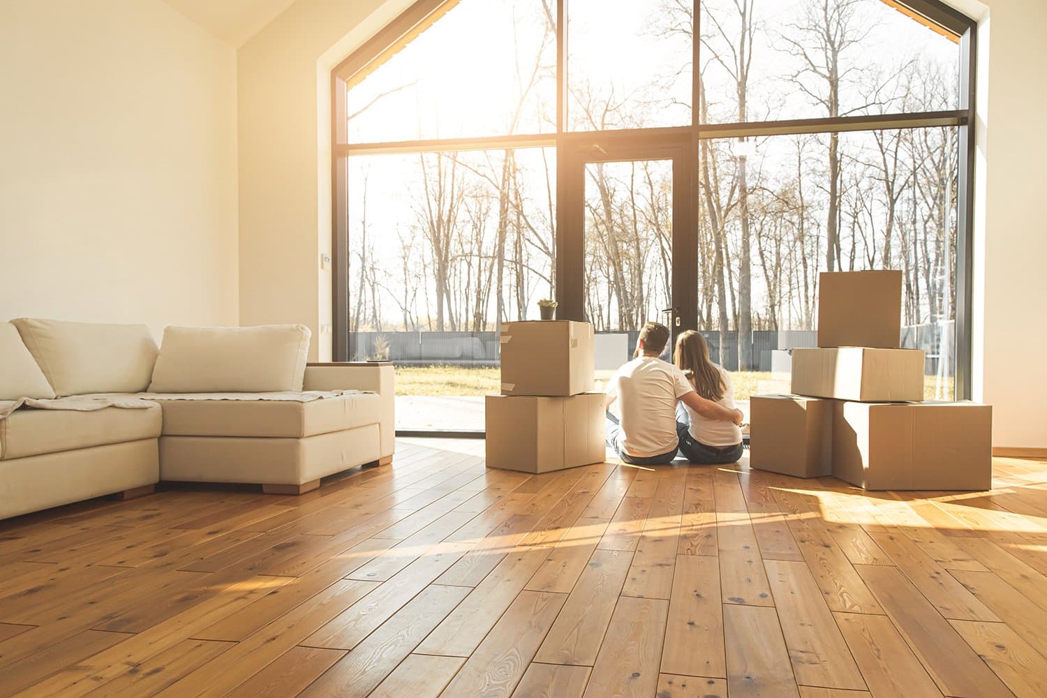 New homeowner reviewing a move-in checklist in their Boulder home with mountain views through the window
