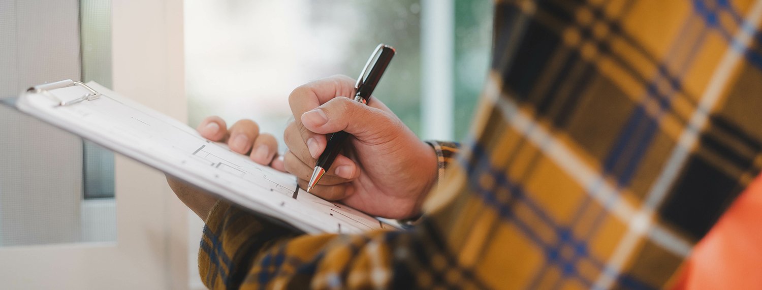  A detail photo of a man making a detailed checklist. If you're looking for the best contractors in Boulder, Willow works with only premium contractors as part of its home concierge service. 
