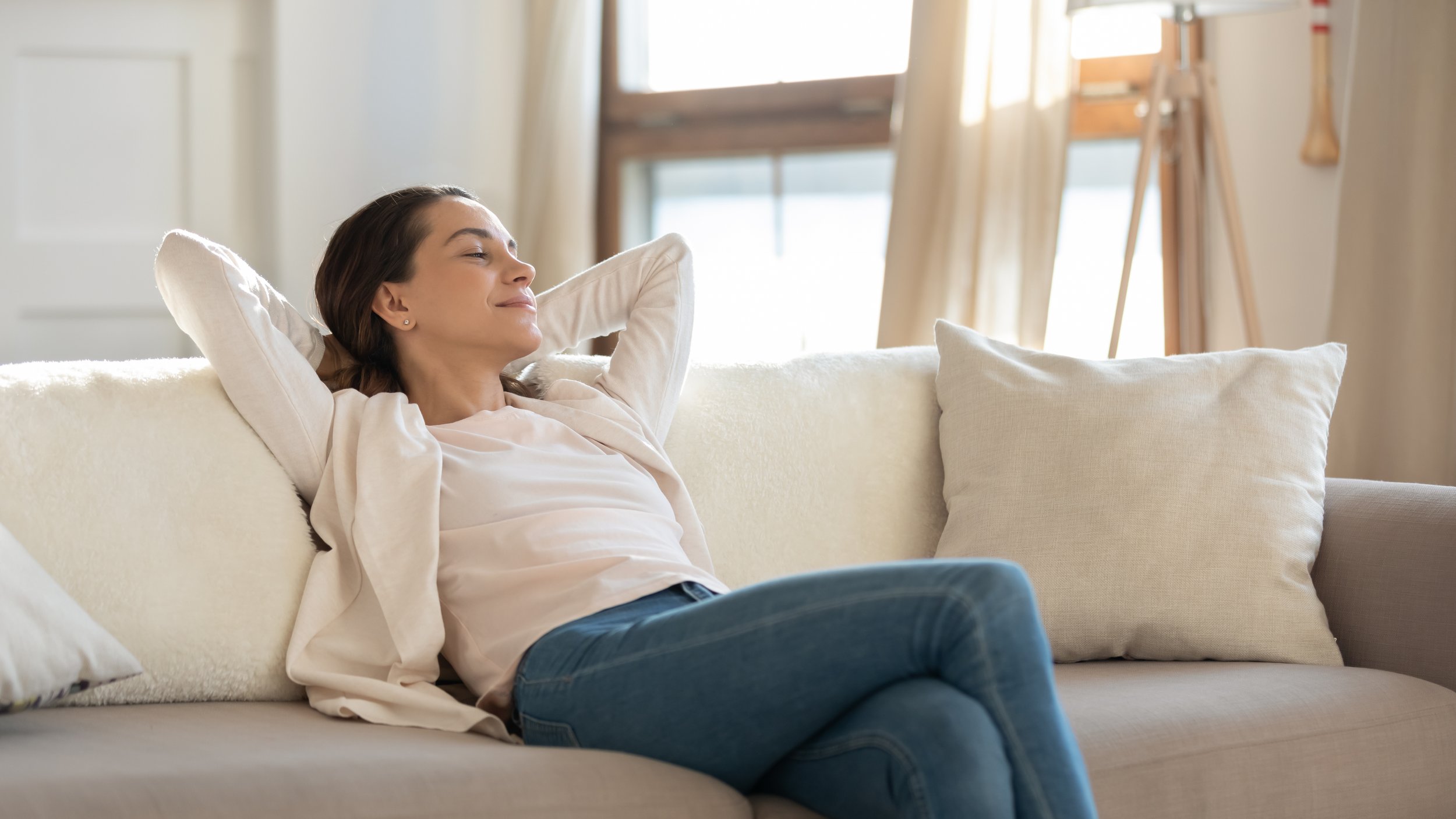 A woman breathes easily at home. Air quality is a top priority for anyone working from home. Learn more about home maintenance tips for your home office in our complete guide.  