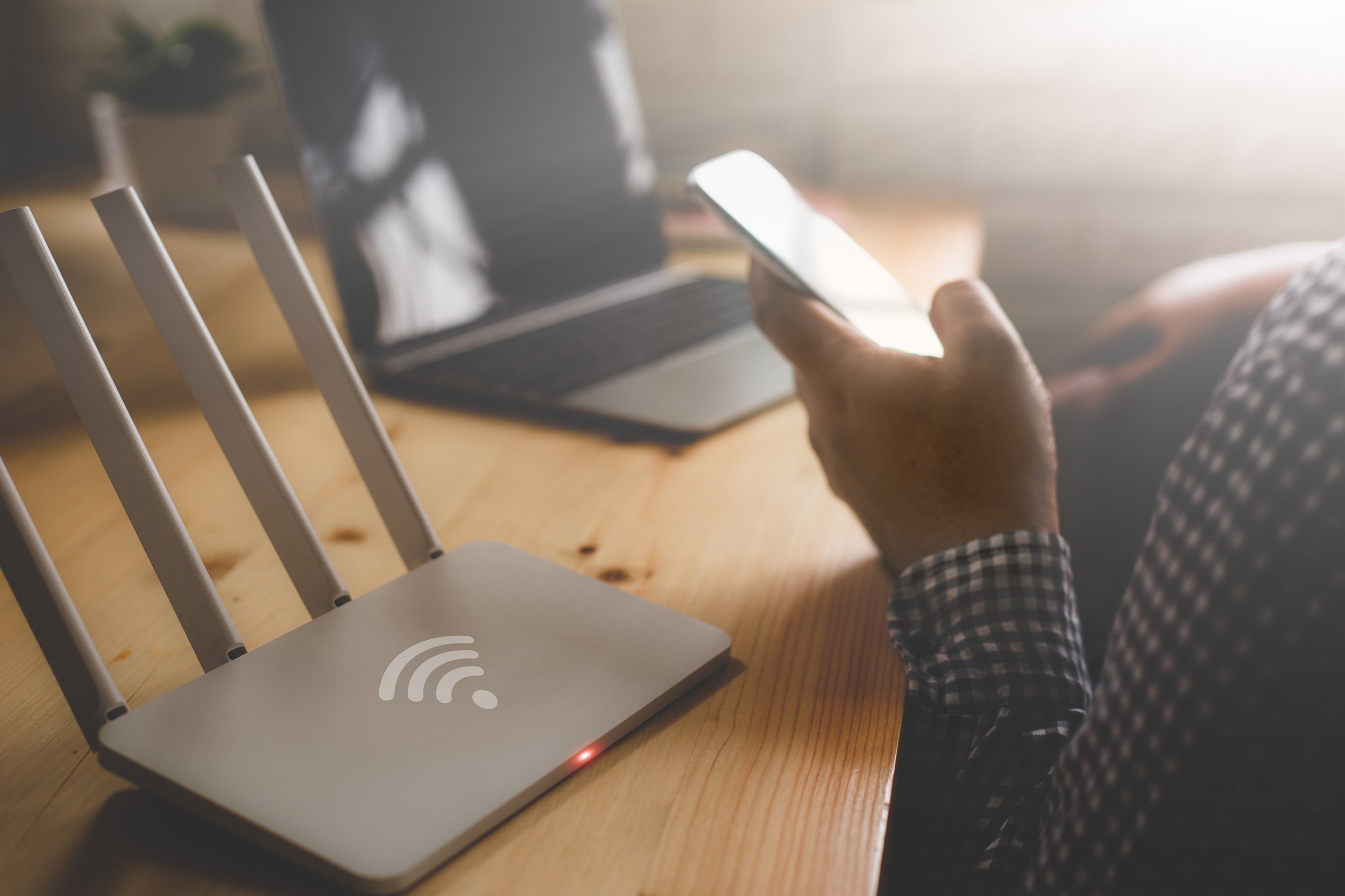  A remote worker sits next to a Wifi hotspot. Internet and power are the foundation of any home based business. Learn more about the best work from home maintenance tips in our complete guide. 