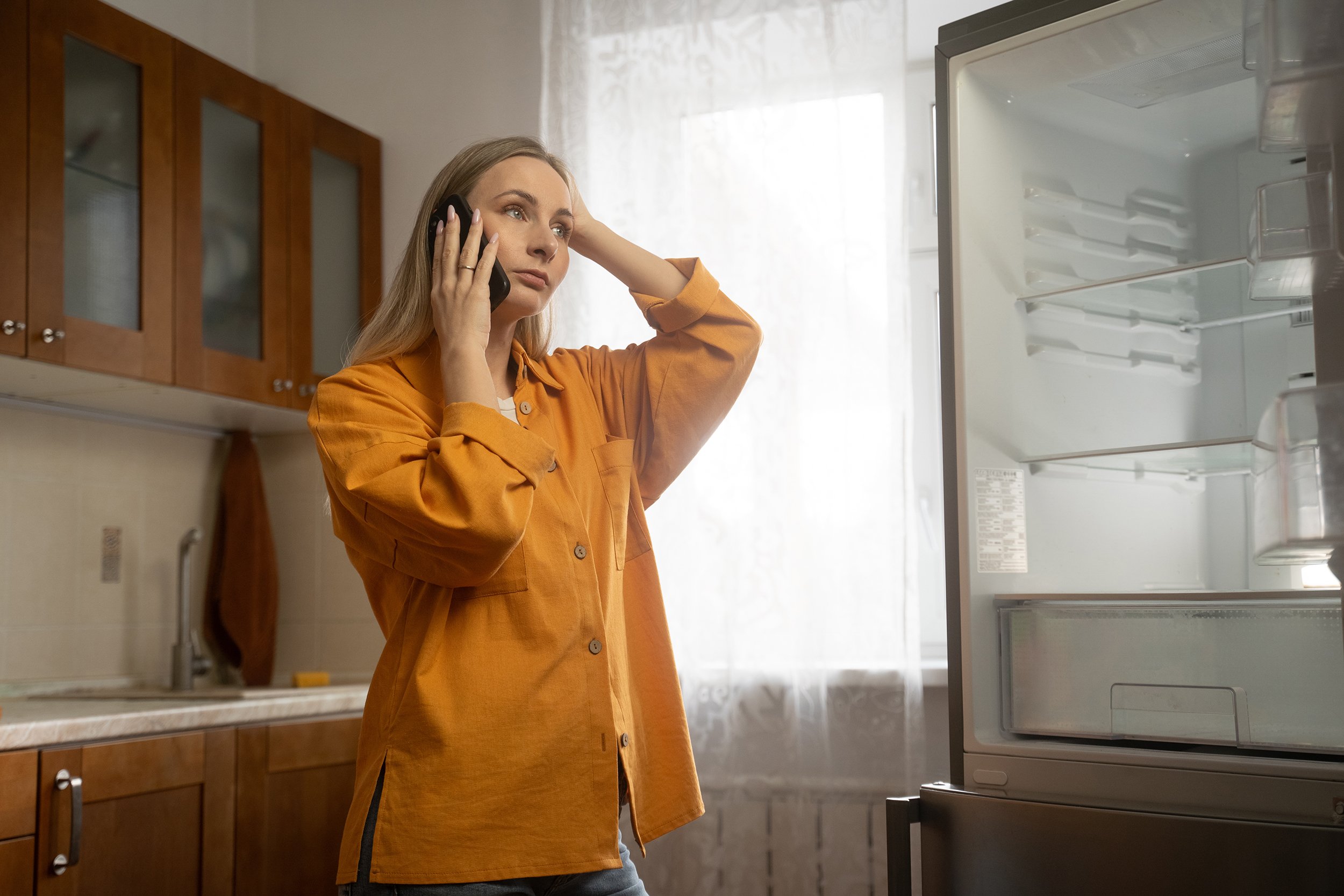  A couple sits in their new home together amid moving boxes. If you've just bought a new home in Boulder, check out our new homeowner's survival guide for everything you need to know about local regulations, wildfire mitigation, and seasonal maintenance. 
